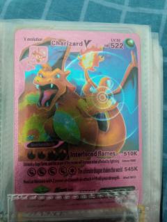 抽出了个喷火龙，我也最喜欢喷火龙。然后就出了三张卡。